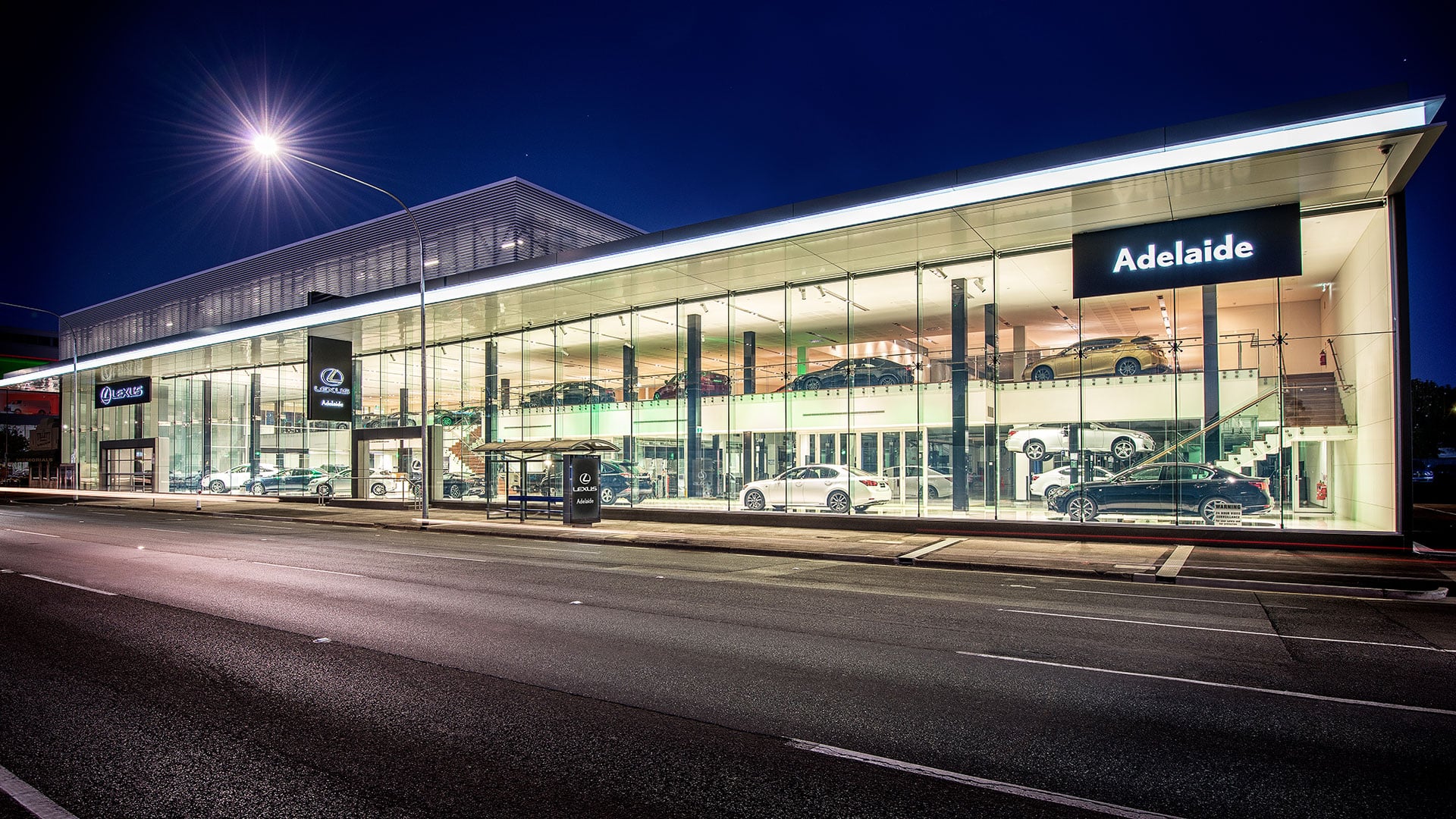 Lexus of Adelaide dealership against a night sky